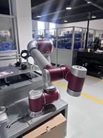 Station de travail automatique de chargement et de déchargement pour machine CNC, avec cobot d'alimentation et robot pour centre d'usinage