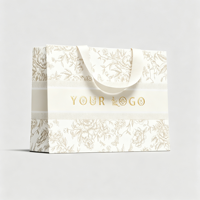 Sac en papier ivoire épais 190-230 g/m² recyclable, personnalisé en usine, avec ruban intérieur, imprimé à l'écran, pour vêtements de luxe de marque