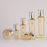 Set Kemasan Perawatan Kulit kaca kosong kustom mewah Set botol Losion Matte selesai Krim Serum Diffuser tutup sekrup cetak layar