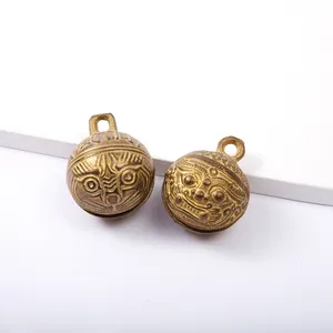 I produttori forniscono ornamenti a campana con testa di tigre in ottone puro campana antica in ottone per animali domestici
