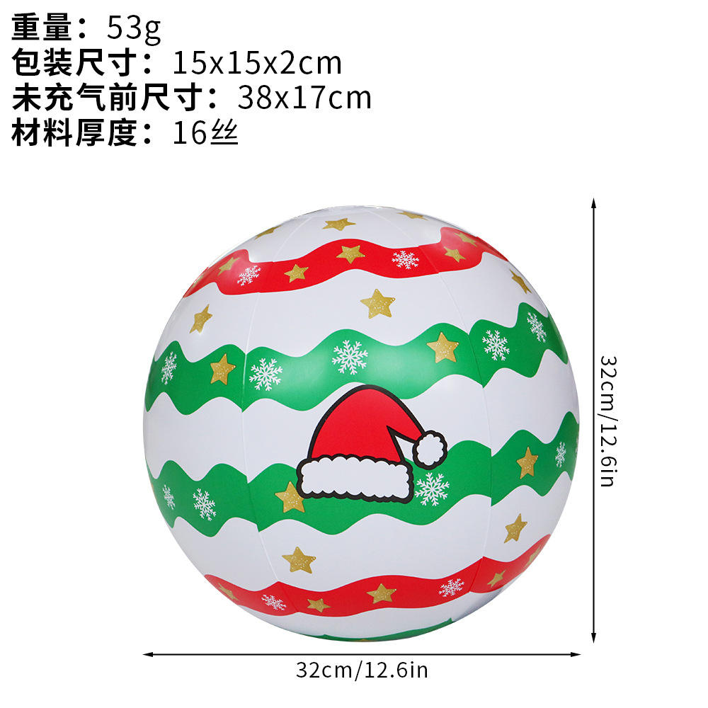 Pelota de playa con gorro navideño.