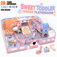 Nouvelle structure de jeu intérieur personnalisée 2026 pour enfants : toboggan, piscine à balles, mur d'escalade, tour arc-en-ciel, écologique et amusante