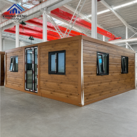 Maison modulaire en conteneurs moderne avec structure coordonnée et multiples fenêtres pour projets résidentiels haut de gamme et maisons d'hôtes