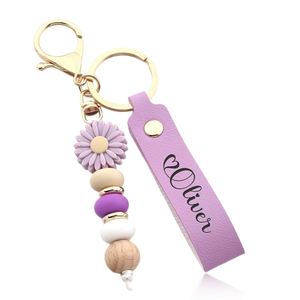 Porte-clés Daisy perlé, breloque florale pour sac, porte-clés en silicone - Accessoire artisanal mignon et élégant pour femme - Product Image 1