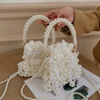 Sac à main mini élégant pour femme en cuir PU avec doublure en PVC, à deux anses perlées et fermeture à cordon, style streetwear