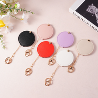 Miroir de maquillage rond en cuir PU avec porte-clés, mini miroir cosmétique portable, miroir de poche tendance pour femmes, cadeau