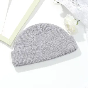 Musim dingin 100% akrilik hangat manset rajutan Beanie untuk pria dan wanita dengan Logo bordir kustom dan desain rajutan