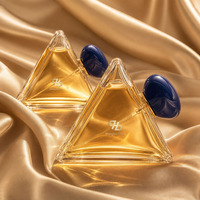 Flacon de parfum en verre triangulaire pyramidal de luxe avec bouchon bleu en forme de galet, logo personnalisé