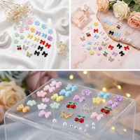 Kit de 24 grilles de décorations pour ongles en résine : nœuds, fleurs, papillons, perles, strass, nœuds papillon mignons et cerises