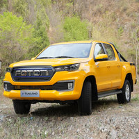 Pick-up électrique chinois Foton Tunland d'occasion, diesel, 4x4, avec cage pour chien, double cabine, petit rayon de braquage, et accessoires.