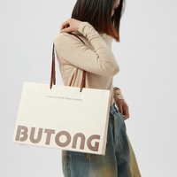 Sac cadeau en papier couché de luxe écologique de haute qualité, design découpé à la main, logo personnalisé, lamination numérique, papier épais sans couture