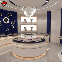 Vitrines élégantes pour bijoux en or bleu, comptoirs de vente au détail blancs avec dessus en verre incurvé et linéaire pour les boutiques