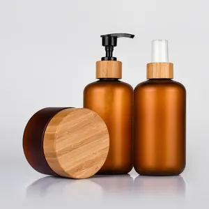 Conjunto de embalagens cosméticas de bambu 250ml 500ml frasco de shampoo PET de plástico fosco âmbar para o corpo com tampa de bambu