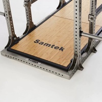 Rack de musculation Samtek en acier inoxydable, structure complète pour squats et développés assis, avec plateforme intégrée pour soulevé de terre