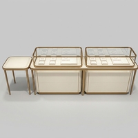 Comptoir de présentation de bijoux de luxe personnalisé avec cadre doré, vitrine en verre LED pour boutique de diamants et de pierres précieuses
