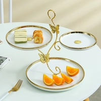 Assiette ronde moderne et simple à trois couches en céramique et porcelaine, incrustée d'or, écologique, pour fruits, pâtisseries et décorations.
