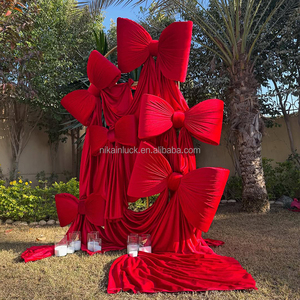 Nika Tùy Chỉnh Bán Buôn Wedding Party Backdrop Bow Lớn Lớn Bow Trang Trí Đạo Cụ Trailing Ribbon Vải Màu Đỏ Drooping Satin Bow - Product Image 1