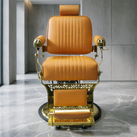 Fauteuil de barbier de luxe avec cadre plaqué or, revêtement en cuir PU orange-brun, appui-tête réglable, inclinable, équipement de salon de coiffure