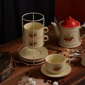 Color esmaltado fábrica al por mayor juego de té de cerámica personalizado patrón de cereza taza de café platillo juego de ollas