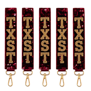Porte-clés en tissu pailleté TXST avec accessoires dorés – Cadeau tendance - Product Image 1