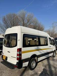 Venta al por mayor Usado 17 plazas Autobús eléctrico Van Alta calidad <span class=keywords><strong>Precio</strong></span> bajo; Características <span class=keywords><strong>BMW</strong></span> BYD Sedan Coaster Modelos R18 Neumáticos 4L Turbo RWD - Product Image 3