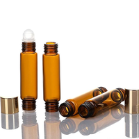 Flacon d'huile essentielle en verre ambré à double tête roll-on de qualité supérieure 10 ml avec diffuseur à bâtonnets et estampage doré pour emballage de parfum et cosmétiques