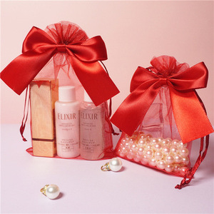 Vente en gros Sac cadeau en <span class=keywords><strong>organza</strong></span> <span class=keywords><strong>rouge</strong></span> avec nœud Conteneur de bijoux cosmétiques de couleur <span class=keywords><strong>rouge</strong></span> attrayante - Product Image 2