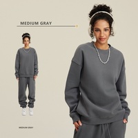 Sweat-shirt à capuche tricoté épais de couleur unie pour l'automne-hiver, avec logo frontal, style européen et américain, marque de mode urbaine, et pantalon de survêtement.