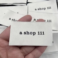 Étiquettes de taille tissées en tissu de haute qualité personnalisées pour vêtements de mode Étiquettes de vêtements imprimées durables avec logo