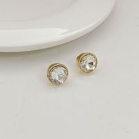Anting-anting stud logam wanita yang indah dengan gaya Eropa dan Amerika, mewah ringan, elegan, manis, bertahtakan rhinestones dan enamel berbentuk bunga.