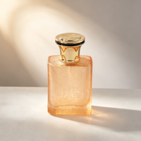 Flacon de parfum de luxe vide en verre pêche 50 ml, surface craquelée, col doré, bouchon noir et or, emballage personnalisé, vente en gros usine