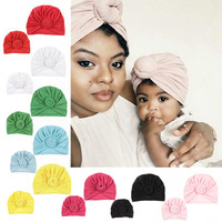 L589 2 unids/set mamá bebé sólido Donut sombreros sólido anudado Cap lindo caracoles recién nacido indio nudo turbante