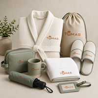 Ensemble souvenir d'hôtellerie VIP haut de gamme avec flacon, journal de voyage, pochette et bougie pour suites d'hôtel et invités d'élite