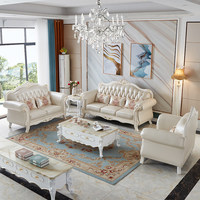 Ensemble de canapés contemporains en cuir véritable avec motifs sculptés en feuille d'or, structure en bois massif et design compact