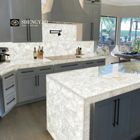 Buffet en pierre translucide en cristal blanc rétro-éclairé de luxe dalle de comptoir en quartz et planche à dosseret