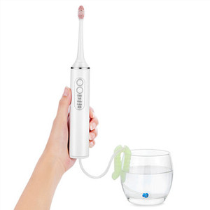 2024 Venta caliente lavado Dental cepillo de <span class=keywords><strong>dientes</strong></span> eléctrico y hilo dental logotipo personalizado limpieza Oral 2 en 1 máquina de limpieza Dental multifuncional - Product Image 2