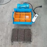 Nouvelle machine manuelle 220V/110V à moteur pour la fabrication de blocs creux en béton et de pavés, avec méthode de vibration pour le ciment