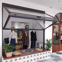 Ventanas plegables de aluminio de estilo americano Sistema plegable de vidrio de rejilla enrollable vertical para bares y cafeterías