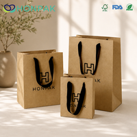Sacs shopping brun naturel avec poignées en ruban noir pour l'emballage de vêtements HONPAK