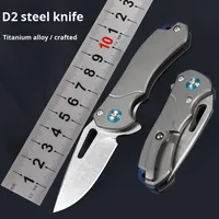 Mini couteau de poche pliant en alliage de titane en acier D2 avec lame en acier inoxydable pour le camping en plein air et l'auto-défense en stock