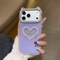 Coque de luxe antichoc avec oreilles de chat, strass, perles et cœur pour iPhone 17 16 15 Pro Max, protection 3D avec nœud et diamants scintillants
