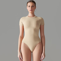 OEM ODM Combinaison sexy gainante pour le fitness, le sport et le yoga, une pièce sans couture, respirante, extensible dans les quatre sens, en Polyester/Nylon