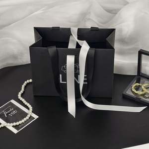 Custom Logo Embossing Printed Clothing Cardboard Retail Paper Shopping <b>Bag</b> Luxury Gift Packaging Paper <b>Bags</b> With Handle Rope - Product Image 2