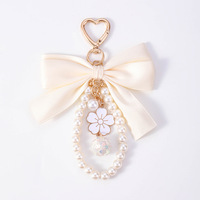 Porte-clés élégant avec nœud en perles, pendentif décoratif pour sac à main pour filles