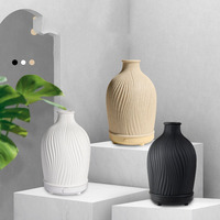 Vase décoratif personnalisable en forme d'humidificateur ultrasonique élégant en polyrésine diffuseur d'huiles essentielles en céramique à saveur artistique