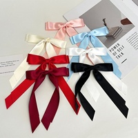 Promotion : Grande pince à cheveux en mousseline de soie style 'Super Fée' pour femme, avec nœud long et couleur unie, dotée d'une pince crocodile