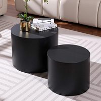 Ensemble de table basse et d'appoint cylindrique noir contemporain à profil bas