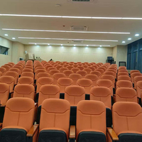 Chaises pliantes modernes en tissu et plastique PP avec pieds en fer, idéales pour les auditoriums, bureaux, écoles et théâtres.