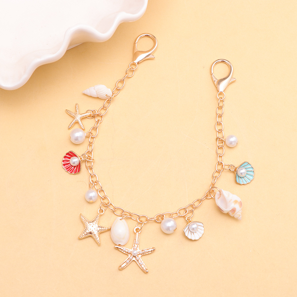 โซ่กระเป๋าลายปลาดาว หอยทะเล และหอยสังข์