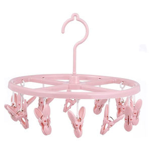 Séchoir à chaussettes multifonctionnel en plastique en forme de pétale, très vendu, avec 12 pinces - Product Image 1